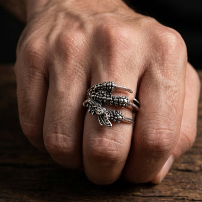 Ultra-Thin Zinc Alloy R-4 Ring by Overpowered Accessories featuring a detailed claw design on a man's hand.