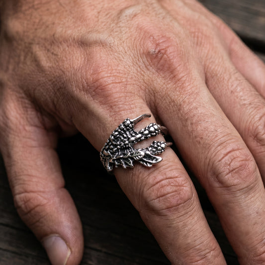 Ultra-Thin Zinc Alloy R-4 Ring by Overpowered Accessories worn on a hand, featuring a detailed claw design.