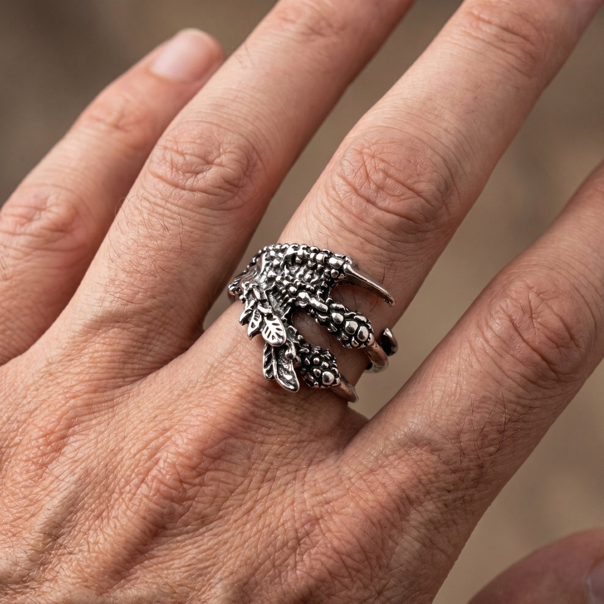 Ultra-Thin Zinc Alloy R-4 Ring by Overpowered Accessories, featuring a detailed claw design on a finger.
