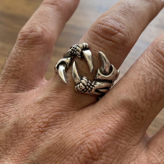 Ultra-Thin Zinc Alloy R-5 Ring by Overpowered Accessories featuring a claw design on a hand. Ideal for men's fashion.
