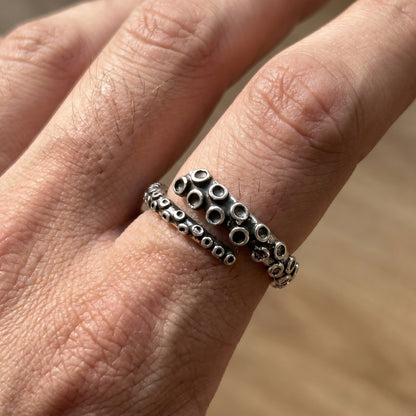Bold Zinc Alloy - R-1 Ring features a textured design with circular patterns, worn on a finger for a stylish look.