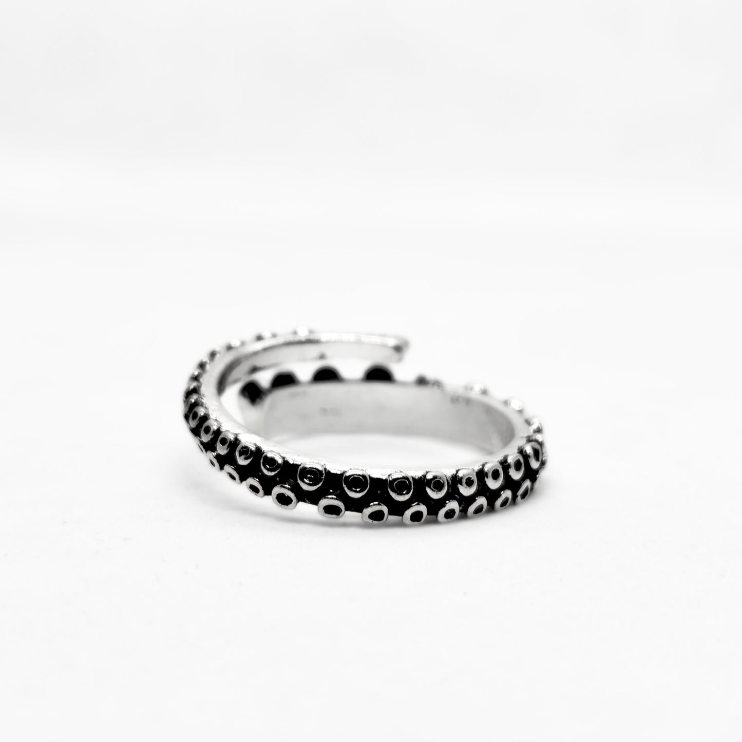 Bold Zinc Alloy - R-1 Ring by Overpowered Accessories features a sleek, twisted design with black and silver accents.