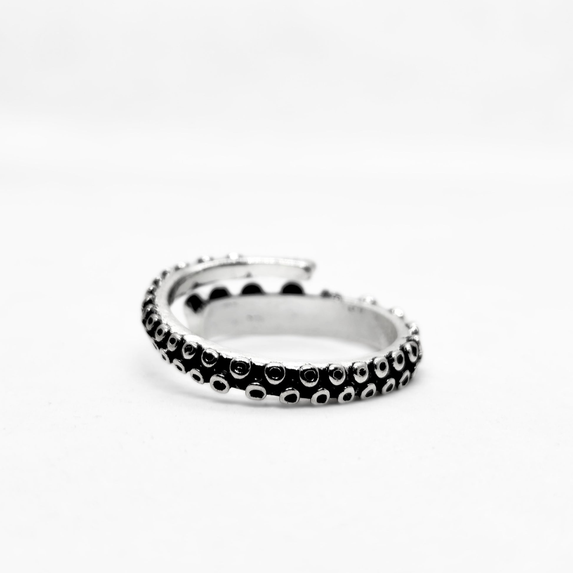 Bold Zinc Alloy - R-1 Ring by Overpowered Accessories features a sleek, twisted design with black and silver accents.