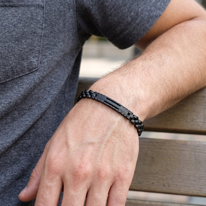 Black stainless steel ID link bracelet on wrist, adjustable fit