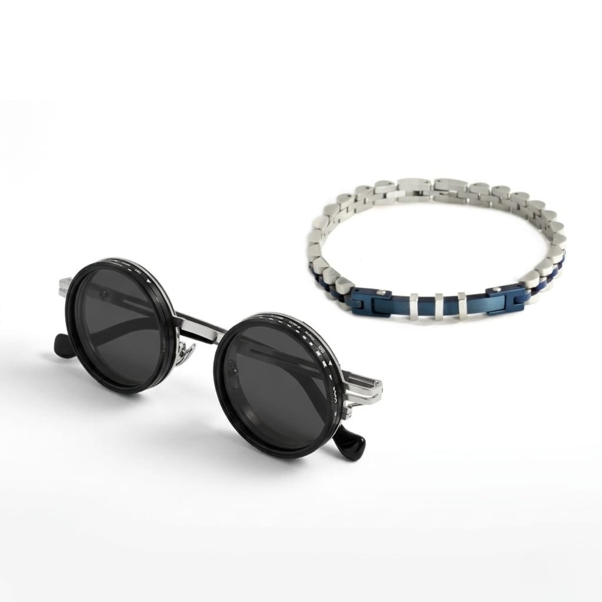 Azure Command Bundle SG-002 B-87 featuring round black sunglasses and a silver and blue men's bracelet.
