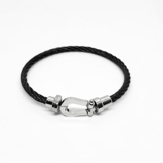 Black cord bracelet with silver magnetic clasp centerpiece and polished metal details