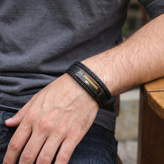 Adjustable men's braided leather bracelet with black strap and gold stripe metal