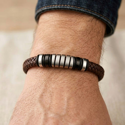 Luxury brown leather and silver stainless steel B-126 bracelet worn on a wrist, featuring a braided design and metallic accen