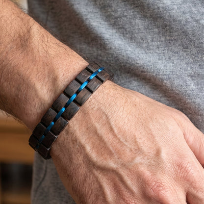 Men's dark wood cuff bracelet with blue channel bands and segmented squares, Overpowered Accessories