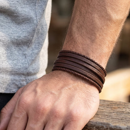 Men's brown leather multi-wrap bracelet with stitched bands on wrist