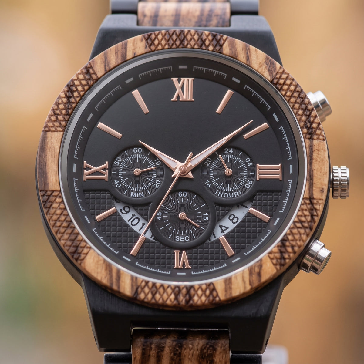 Men's zebrawood and ebony wood wristwatch close-up on wrist, black dial with subdials, Overpowered Accessories