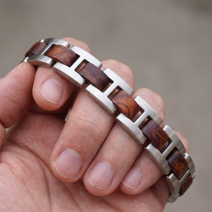 Close-up stainless steel and rosewood inlay bracelet with silver link blocks and brown panels, Overpowered Accessories