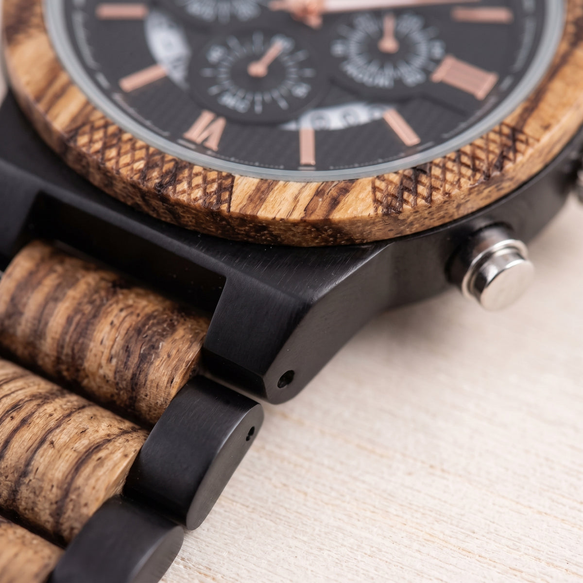 Men's zebrawood and ebony wood watch side detail, black case, zebrawood strap segments, Overpowered Accessories