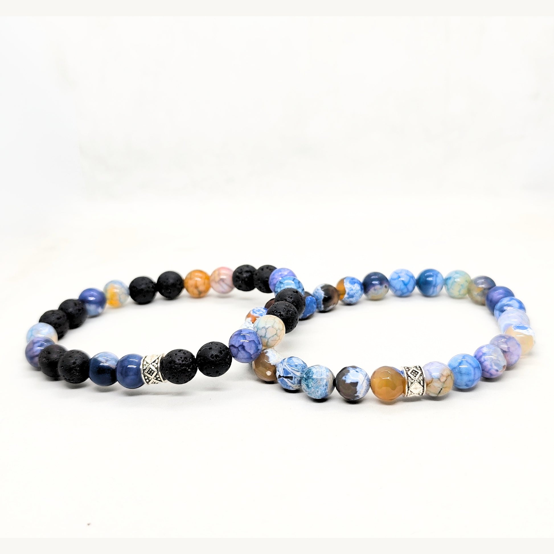 Men's stone bead bracelet set with blue, black, and earth-tone beads.