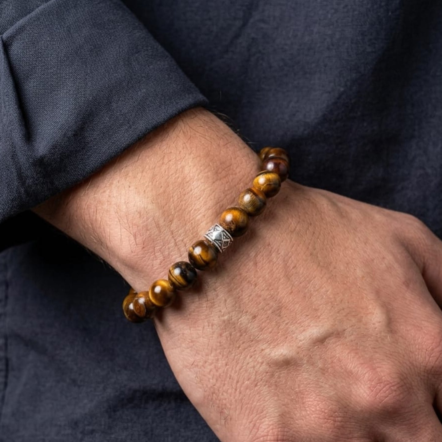 Men's Vigilant Vision Bundle G-8 SG-001 featuring a tiger's eye bracelet with a silver accent, worn on a wrist.