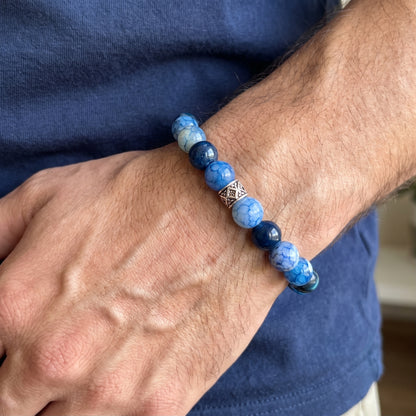 Blue agate bracelet with blue and gray beads and diamond-pattern metal centerpiece