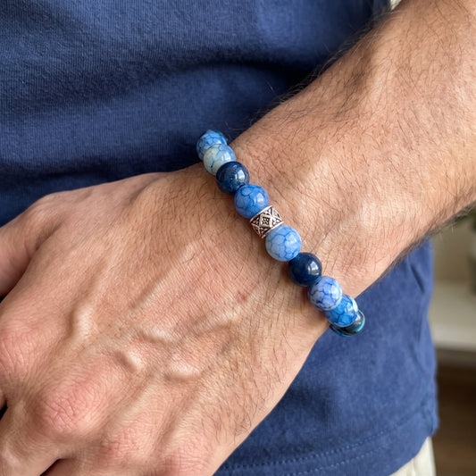 Blue agate bracelet with blue and gray beads and diamond-pattern metal centerpiece