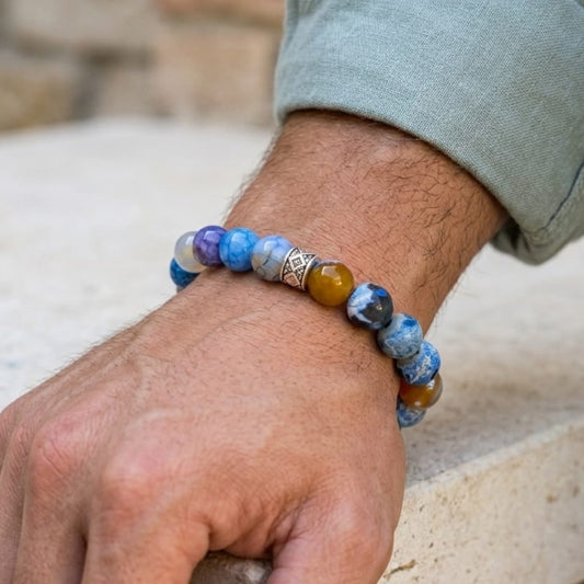 Men's Titan Meridian Bundle SG-002 G-10 features a colorful beaded bracelet worn on a wrist, showcasing various stone texture