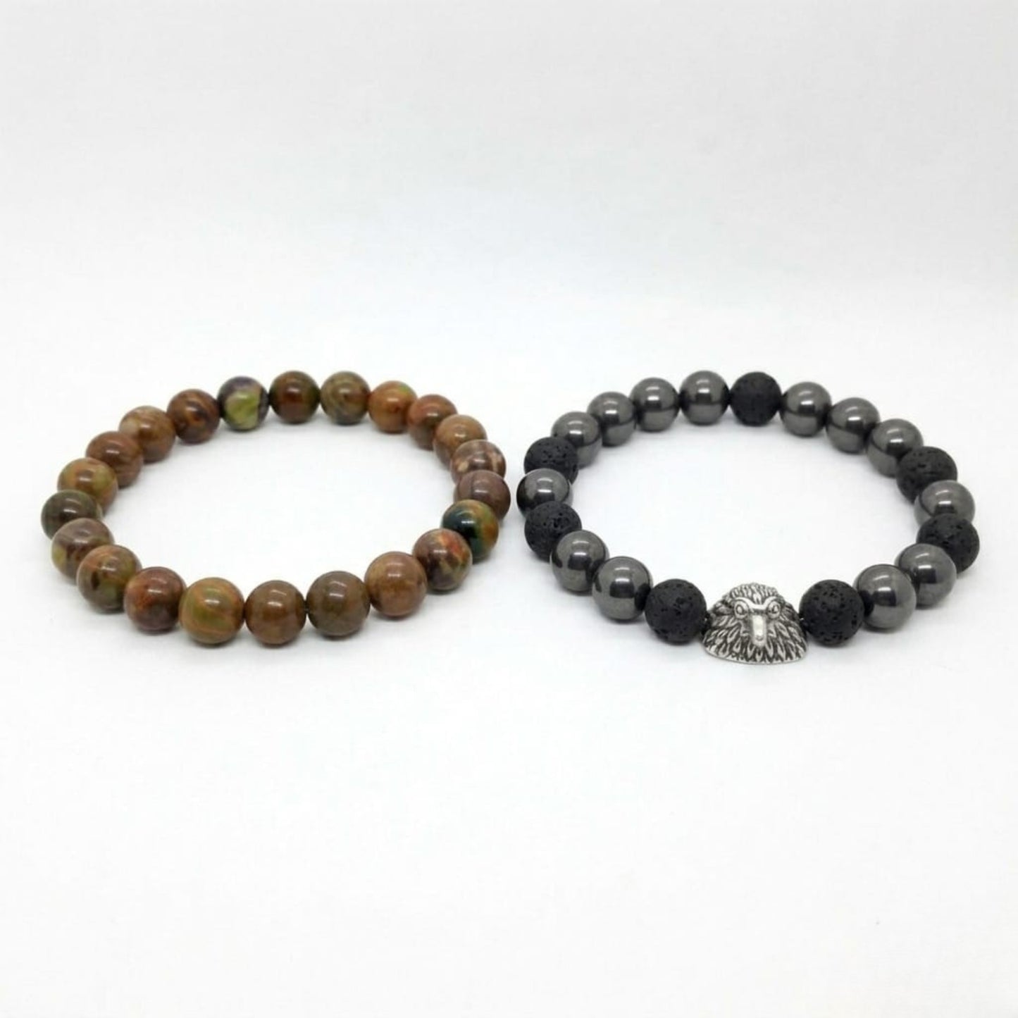 Men's Earthbound Sovereignty Bundle G-5 G-6 stone bracelets featuring earthy tones and a silver lion head charm.