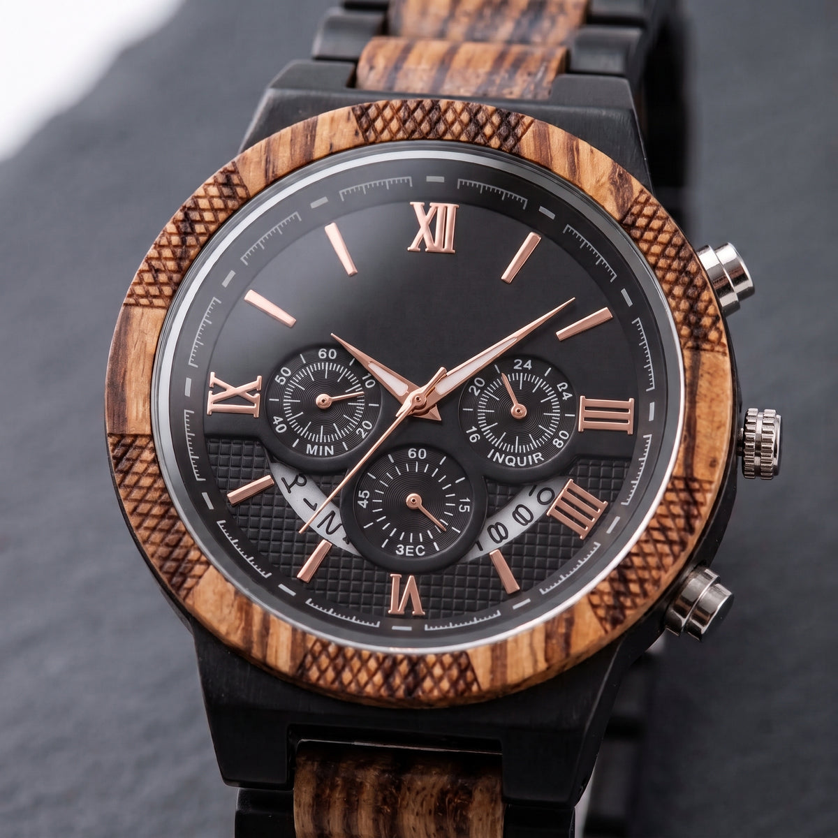Men's zebrawood and ebony wood chronograph wristwatch close-up, black dial with Roman numerals, Overpowered Accessories
