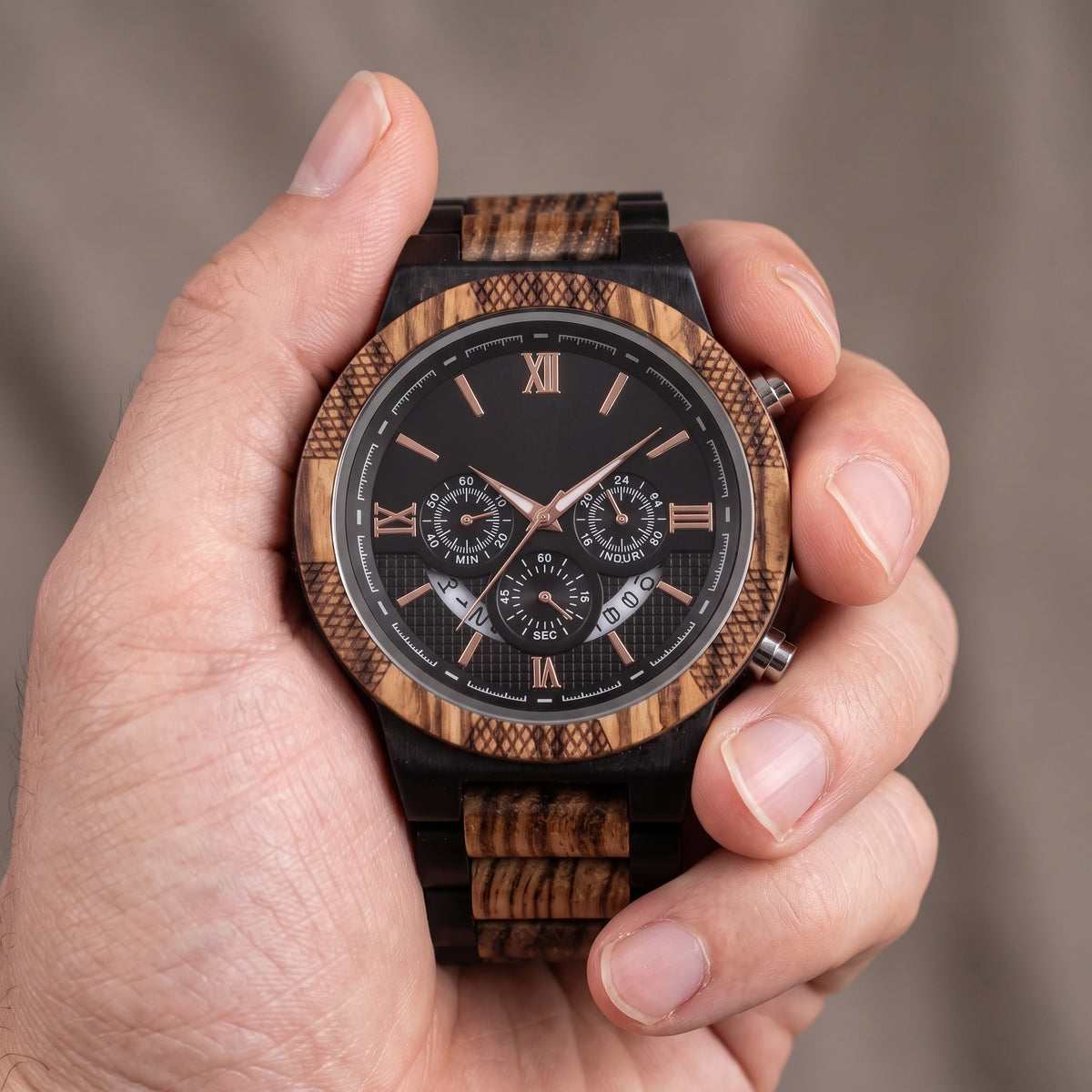Men's zebrawood and ebony wood wristwatch front view, black dial, rose-gold details and subdials, Overpowered Accessories