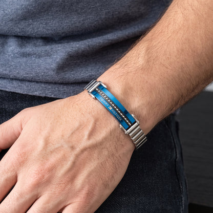 Men's stainless steel bracelet with blue insert and engraved text on the link