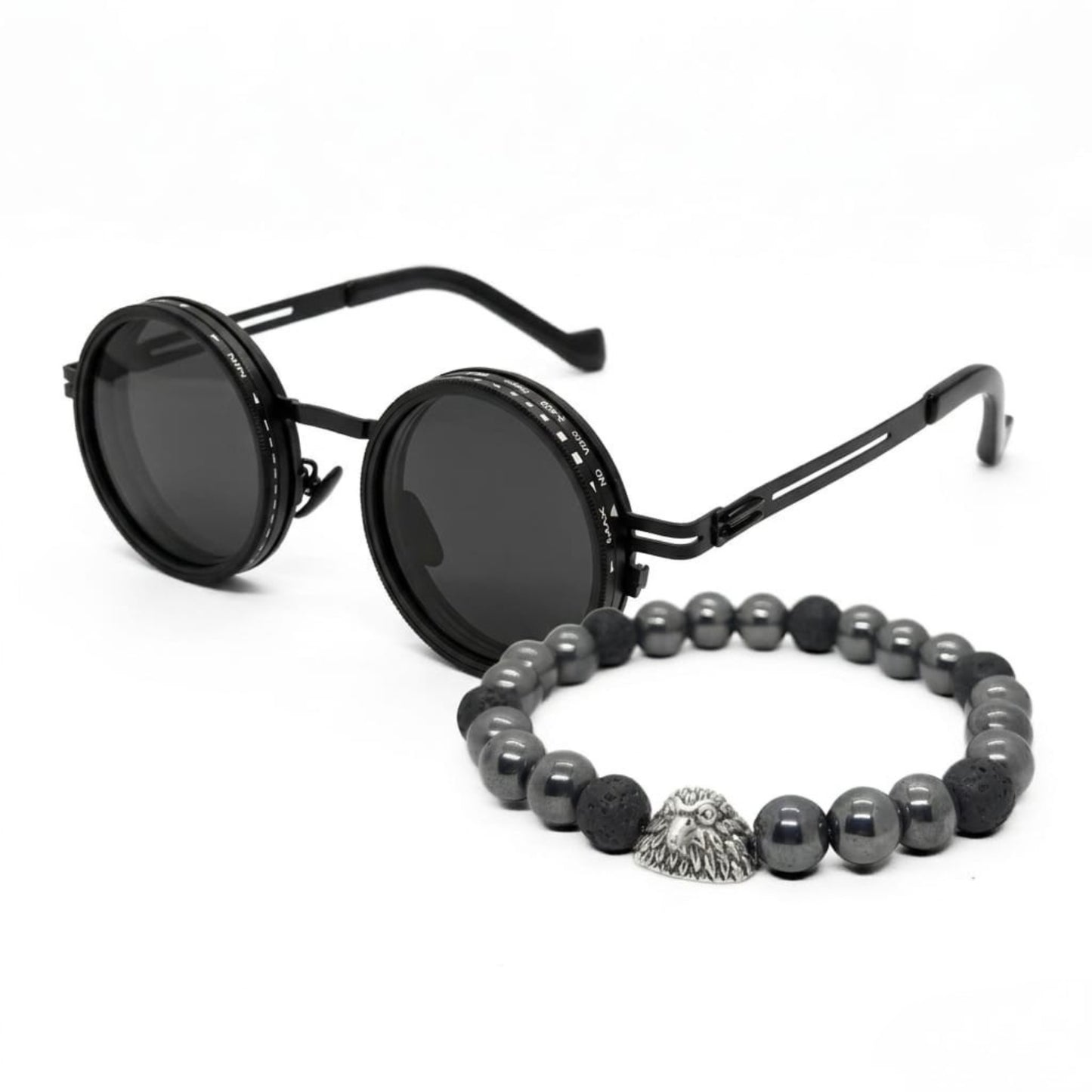 Men's sunglasses with round black frames and dark lenses, paired with a beaded bracelet featuring silver and black stones.