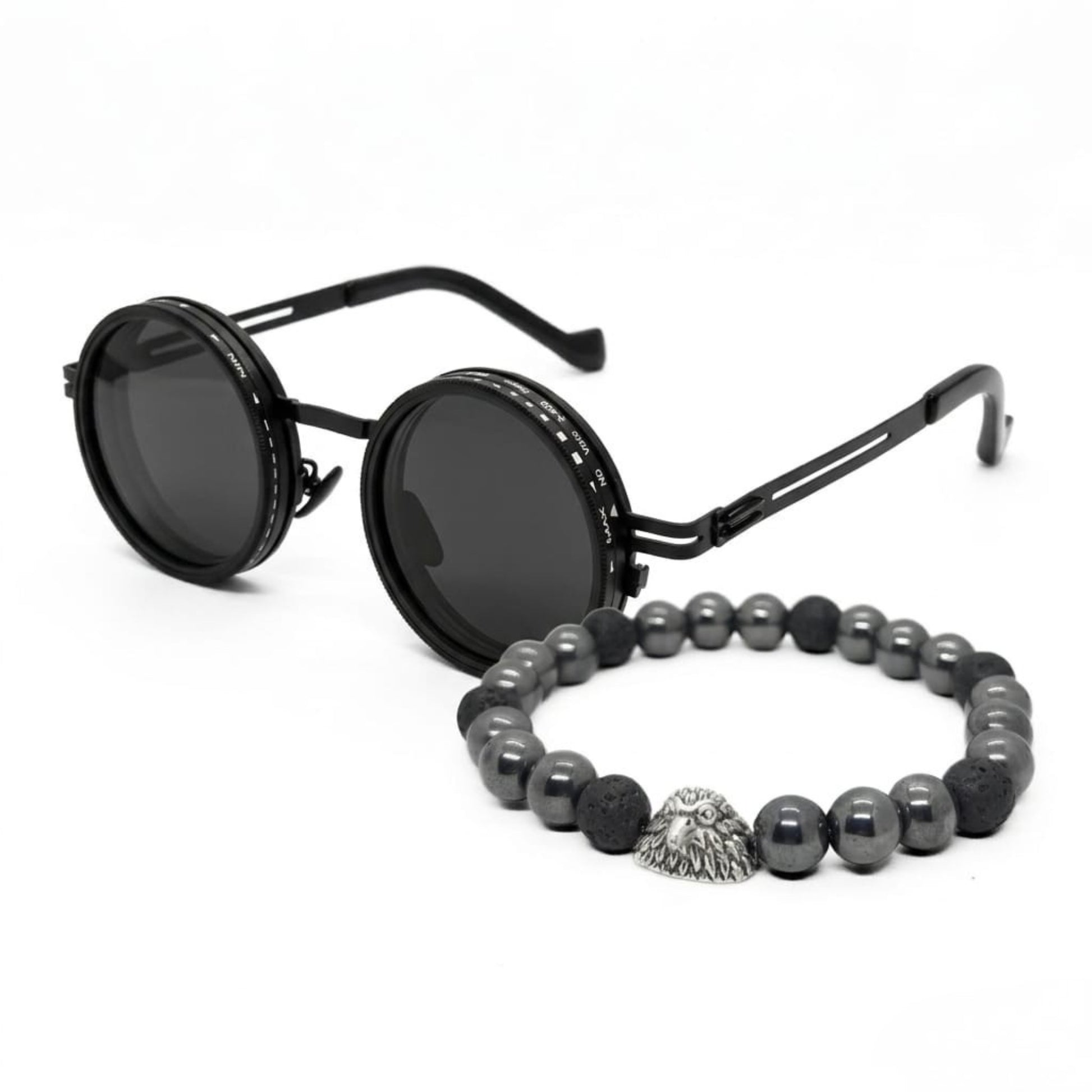 Men's sunglasses with round black frames and dark lenses, paired with a beaded bracelet featuring silver and black stones.