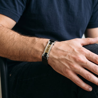 Men's Greek key cuff bracelet featuring gold pattern in silver with black link segments