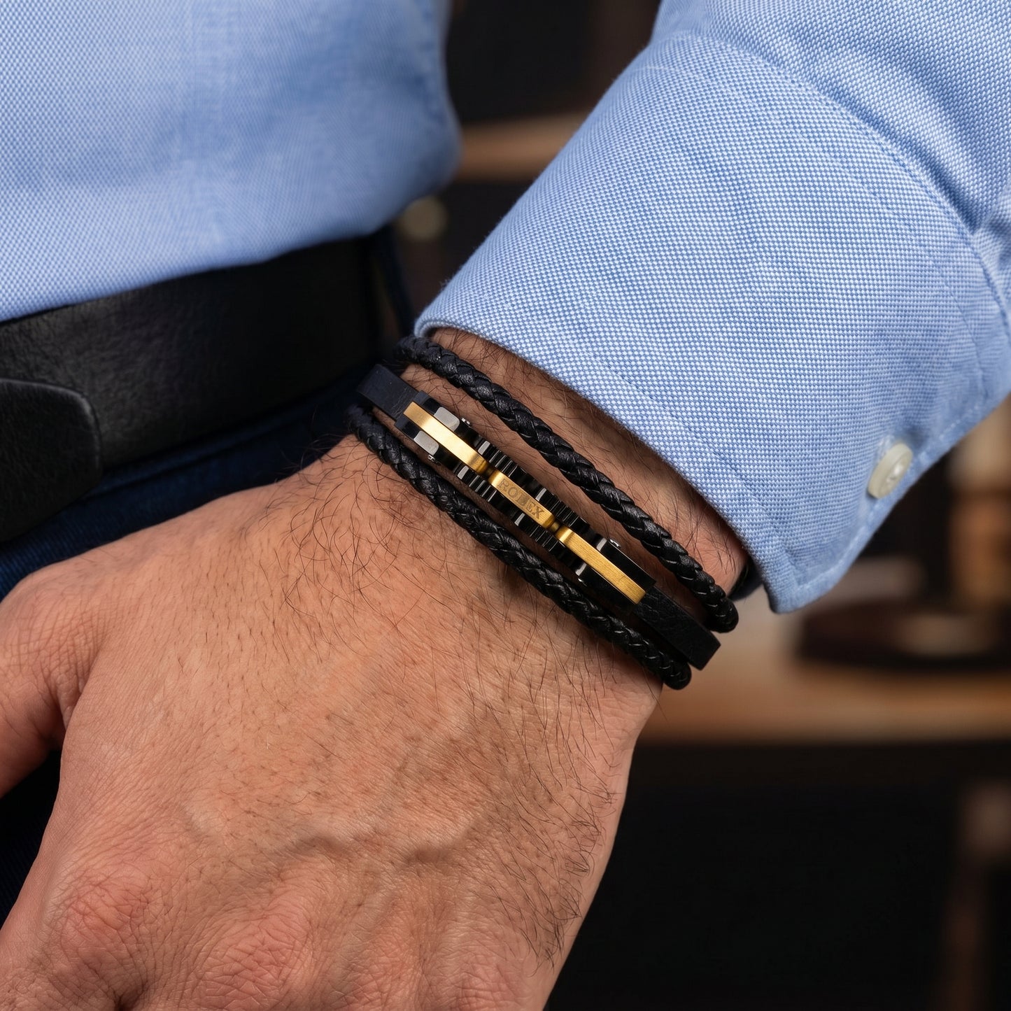 Men's black leather wrap bracelet, braided straps with gold-tone center bars