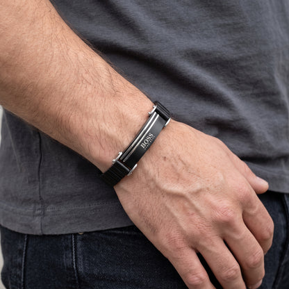 Men's black stainless steel ID bracelet with silver stripe clasp on wrist