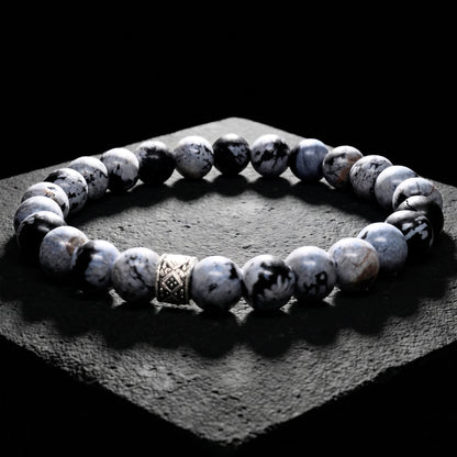 Men's gray obsidian bead bracelet with carved metal spacer and elastic fit
