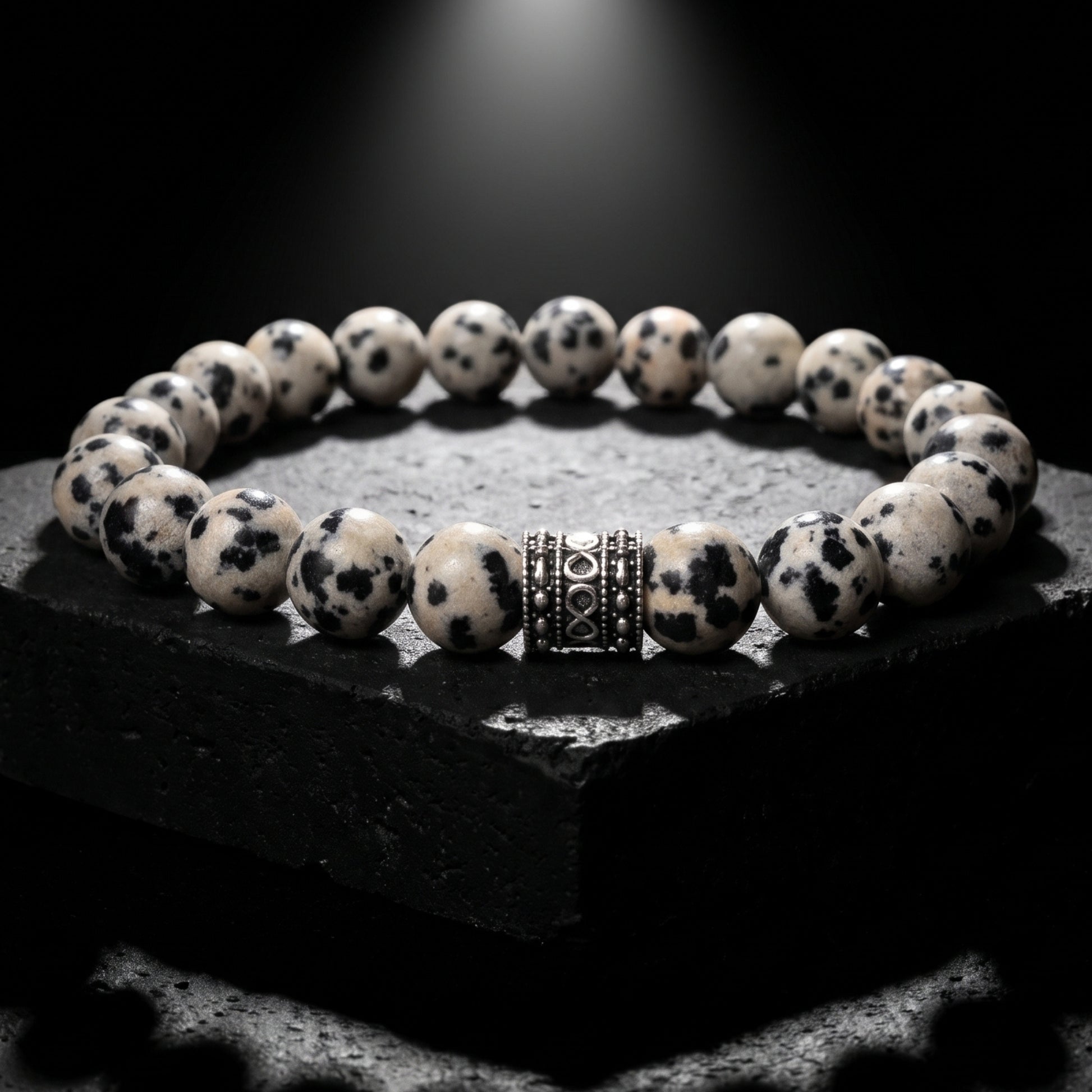 Men's jasper bead bracelet with round speckled stones and a silver-tone spacer centerpiece